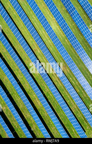 Aerial view looking straight down of a solar farm with sun reflecting off the panels, West of Dunville; Ontario, Canada