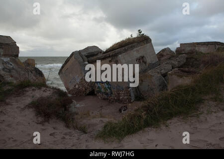 Abandoned coastline fortifications falling into baltic sea from the former Soviet military base, Liepaja, Karosta, Latvia Stock Photo