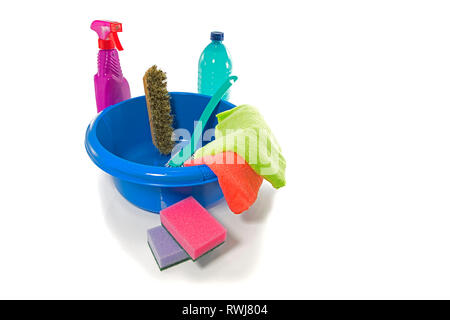 blue washing up dish with cleaning tools and detergents as degreaser and a brush with wipes insulated on white background Stock Photo