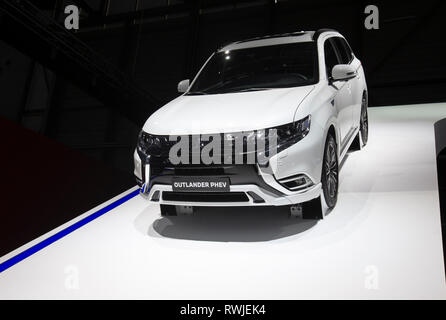 Geneva. 6th Mar, 2019. Photo taken on March 6, 2019 shows the new Mitsubishi Outlander PHEV at the 89th Geneva International Motor Show in Geneva, Switzerland. Electric cars and hybrid cars are highlights at this year's Geneva International Motor Show, which will open to the public from March 7 to 17. Credit: Xu Jinquan/Xinhua/Alamy Live News Stock Photo