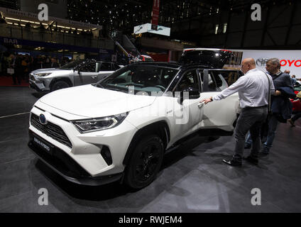 Geneva. 6th Mar, 2019. Photo taken on March 6, 2019 shows the new Toyota RAV4 Hybrid at the 89th Geneva International Motor Show in Geneva, Switzerland. Electric cars and hybrid cars are highlights at this year's Geneva International Motor Show, which will open to the public from March 7 to 17. Credit: Xu Jinquan/Xinhua/Alamy Live News Stock Photo