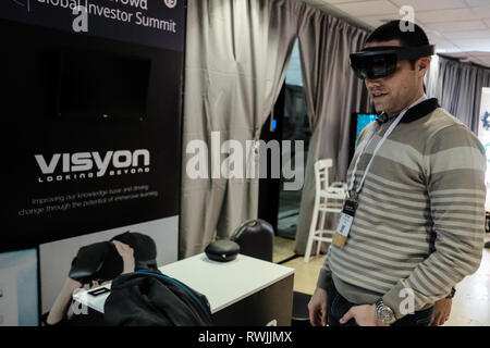 Jerusalem, Israel. 7th March, 2019. Visitors experience virtual reality by Visyon. OurCrowd, a global investment platform and Israel’s leading venture investor summit, considered the largest technology showcase in Israel, opened at the International Convention Center in Jerusalem featuring over 170 startups with 17,000 registered attendees. OurCrowd, managed by a team of investment professionals and led by entrepreneur and founder Jon Medved, announced that it raised a total of $1 billion for 170 companies and 18 funds in just six years. Credit: Nir Alon/Alamy Live News Stock Photo