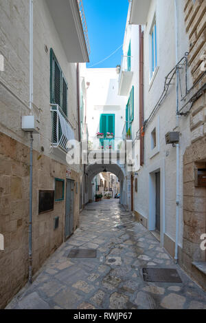 Monopoli, Puglia, Italy - Street and alley with a view of colorful houses in the old town. A region of Apulia Stock Photo