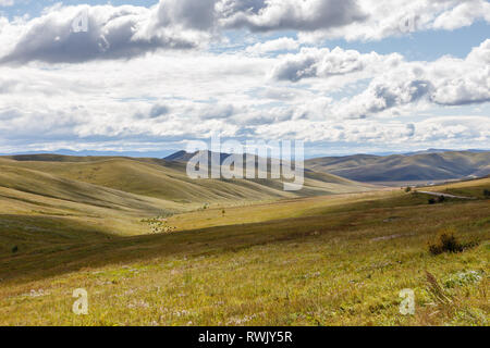 Mongolian steppe on the background of a cloudy sky, beautiful landscape. Mongolia Stock Photo