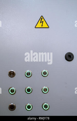 Industrial background. Electric shield with control panel with buttons for switching on and off electrical equipment. Close-up. Stock Photo