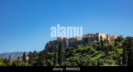 Acropolis of Athens Greece rock and Parthenon on blue sky background, sunny day. View from Thissio area Stock Photo