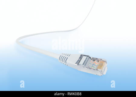 Network cable wide angle view with selective focus. Isolated on abstract blue background, clipping path included Stock Photo