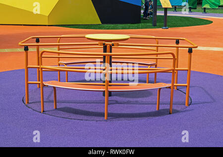 Metallic children's carousels of a special type for which children can be stopped on wheelchairs Stock Photo