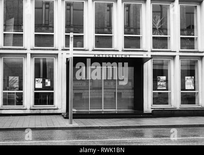 Karlsruhe, Germany - Oct 29, 2017: Mai entrance to Amtsgericht translated from german as District Court on top of the building - black and white Stock Photo