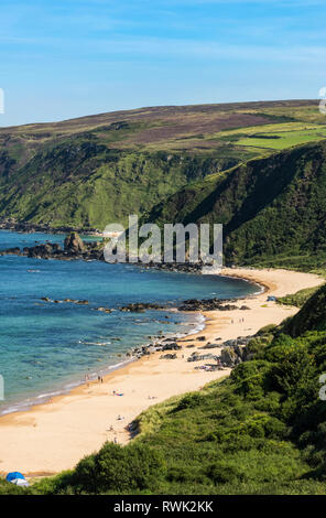 The remote beach along the coastline in Kinnagoe Bay; County Donegal, Ireland Stock Photo