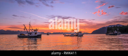 Seiners anchored in Amalga Harbor at sunset awaiting a commercial salmon opening, Southeast Alaska; Juneau, Alaska, United States of America Stock Photo