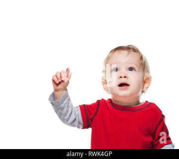 Cute one year old baby boy looking up and pointing. Isolated on white Stock Photo