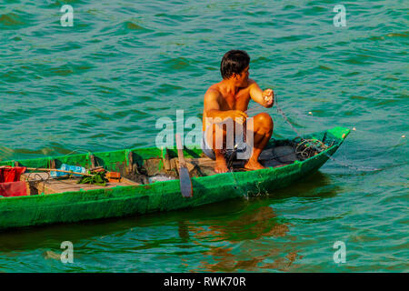 Local Vietnamese fisherman on small  boat  Tan Chau,, An Giang Province Mekong River, Vietnam, Asia Stock Photo