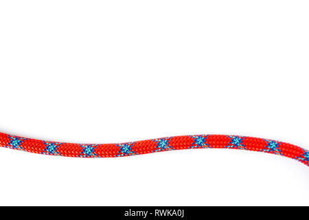 9.8 mm climbing rope strand, isolated on white background. String of mountaineering coil rope with red and blue abstract "X" pattern on it. Stock Photo
