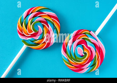 Colorful lollipops on blue background Stock Photo