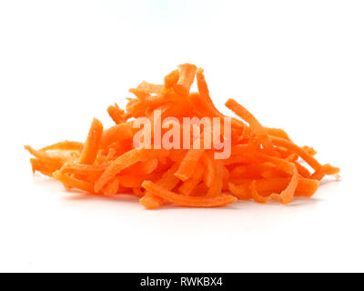 Pile of fresh organic shredded carrots. Raw grated carrots isolated on white with clipping path. Stock Photo