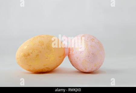 Golden painted easter eggs on  white background Stock Photo