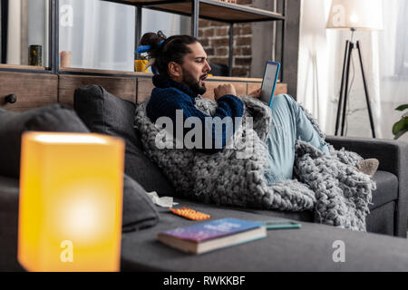 Nice sleepy man feeling low on energy Stock Photo