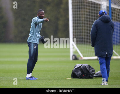 Chelsea's Antonio Rudiger shares a joke with manager Maurizio Sarri during the training session at Cobham Training Ground, London. Stock Photo