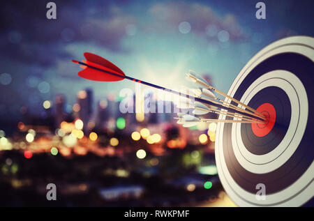 Arrow hit the center of target with modern skyline background. Business target achievement concept. 3D Rendering Stock Photo