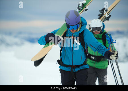 Landscape with male skiers trudging in snow, Alpe-d'Huez, Rhone-Alpes, France Stock Photo
