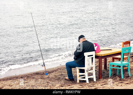 Fishing equipment on a old wooden table. Sport and recreation
