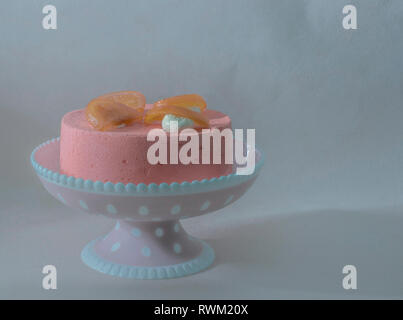 Almond cake with strawberry and grapefruit on vintage background. Stock Photo