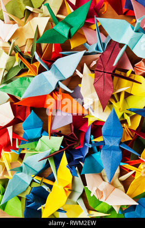 background of various colorful origami birds Stock Photo