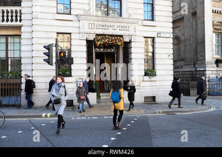 Lombard Street restaurant exterior view of front entrance and people walking in the street in the City of London EC2  ENGLAND UK  KATHY DEWITT Stock Photo