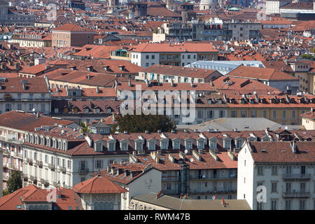 Turin, Italian city rooftops and buildings background view in a sunny summer day Stock Photo