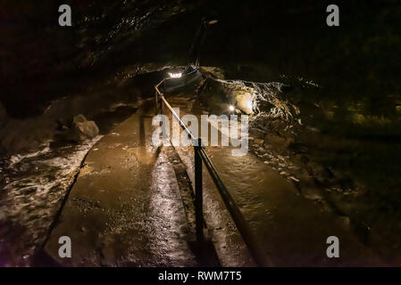 Wind Cave & Ice Cave in Fugaku Japan. The Fuji Fugaku Wind Cave is surrounded by the abundant greenery of the Aokigahara Jukai forest. Once you enter Stock Photo