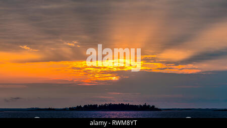 Sunset over pine-covered island in the 30000-island archipelago of the Georgian Bay, Ontario, Canada Stock Photo