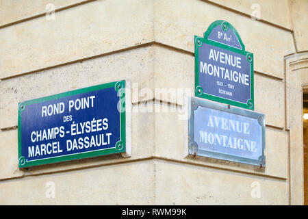 PARIS, FRANCE - JULY 22, 2017: Famous Champs Elysees and Avenue Montaigne corner and street signs in Paris, France. Stock Photo