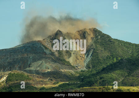 Iron Exploration - Blast in open cast mining quarry Stock Photo