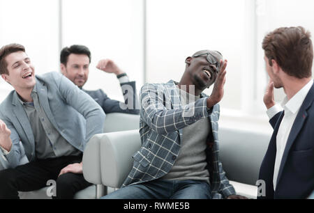 close up.cheerful co-workers giving each other a high five Stock Photo