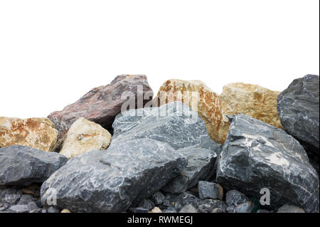A pile of large natural granite stones isolated on a white background. Stock Photo