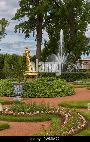 ST. PETERSBURG, RUSSIA - JULY 08, 2017: Golden statue at Peterhof Gardens, close to St. Petersburg in Russia. Stock Photo