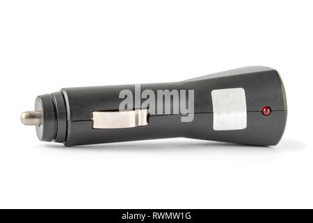 Car charger on a white background. Adapter, car cigarette lighter, for mp3, mp4 player, for e-books, for tablet, for phone , smartphone, universal. Stock Photo