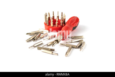 A set of bits for screwdrivers on a white background. A set of bits for repair and electronics. Stock Photo
