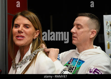 MILAN, ITALY - FEBRUARY 21: Designer Jeremy Scott and Anna Dello Russo posing backstage before the Moschino show at Milan Fashion Week. Stock Photo