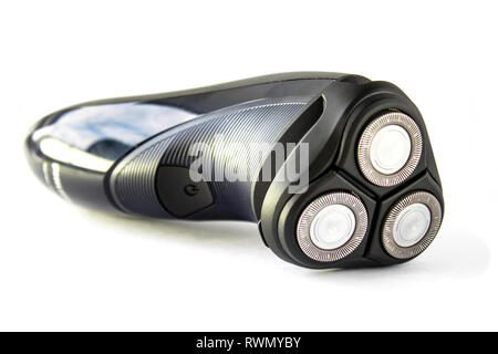 Electric shaver for people close-up on a white background. Black color shaver. Stock Photo