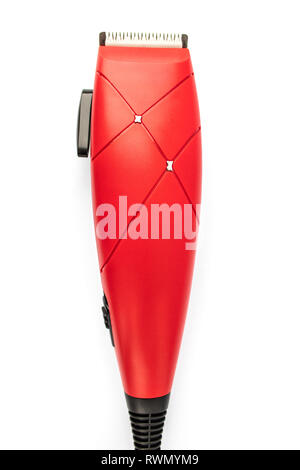 Red hair clipper on a white background close-up. Stock Photo