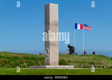 The Utah Beach American Memorial with the US Navy Memorial and flags of America & France behind, Utah Beach, Normandy, France. Stock Photo