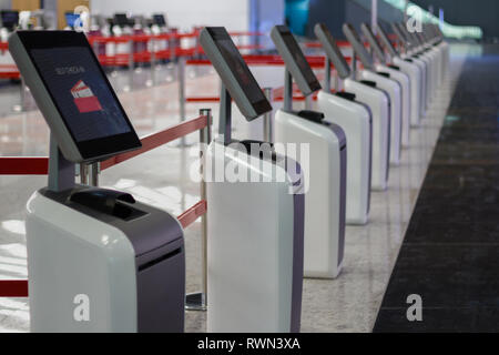 Airport self check-in kiosk ticket machine Stock Photo