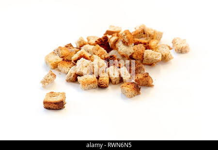 Croutons isolated white background. Home-made bread croutons Stock Photo