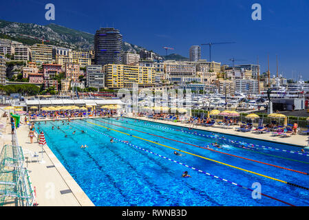 Open air swimming pool in city center of La Condamine, Monte-Carlo, Monaco, Cote d'Azur, French Riviera. Stock Photo