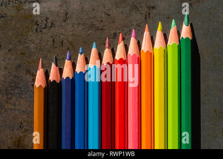 Coloured pencils lined up in a row - colourful concept Stock Photo