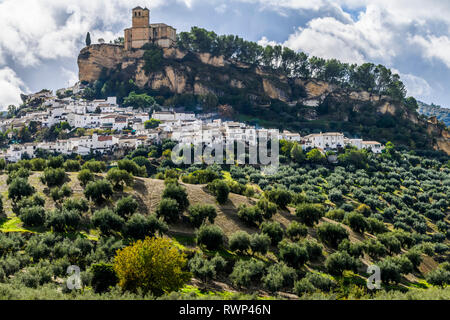 Ruins of a Moorish castle on a hilltop with houses and an olive grove filling the hillside; Montefrio, Province of Granada, Spain Stock Photo