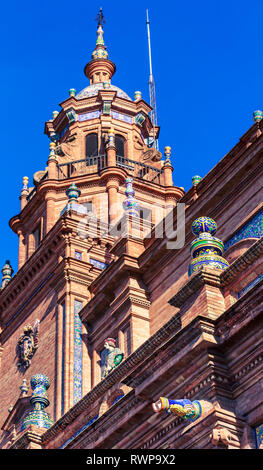 Seville, Spain - Dec 2018: Bottom up view of the left tower of the main central building at Spain Square Stock Photo