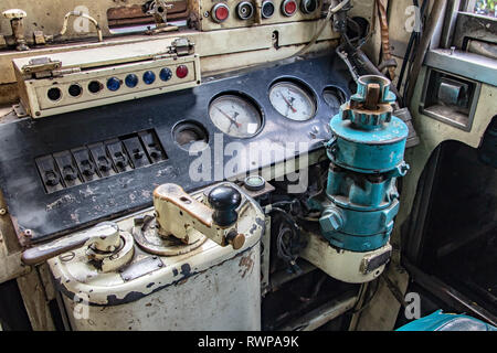 Control panel inside the train driver's cab in the old train. The retro dashboard inside driver cabin. Mechanical control in historical locomotive. Stock Photo